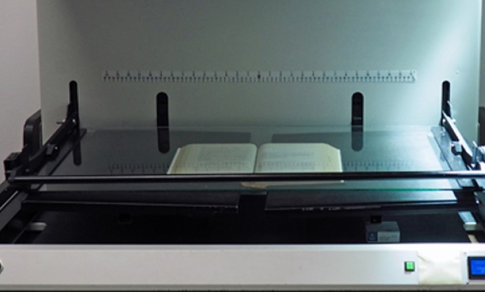 Photo of nondestructive scanning to digitize and preserve law books